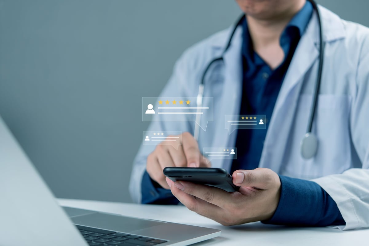 Doctor using mobile phone to check patient feedback and online review ratings, representing healthcare digital service, telemedicine, trust, and modern medical technology.